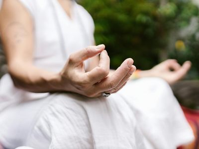Close up of hands in a mudra position during meditation